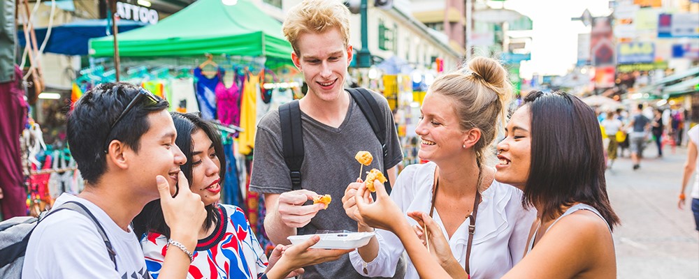 Friends enjoying street food